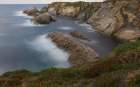 Spain, Cabo Blanco. Ocean rock formations and cliff. Art Print